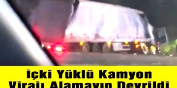 İçki Yüklü Kamyon Virajı Alamayıp Devrildi