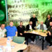 Asi Cafe'de Bodrumspor posteri önünde oturan bir grup erkek.